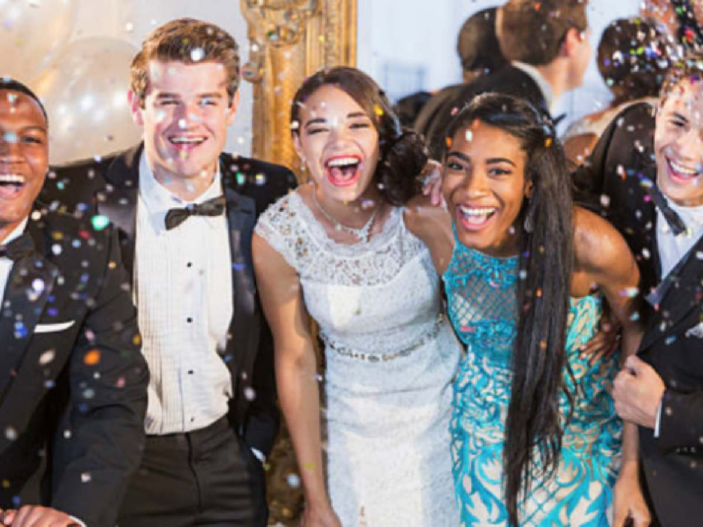 High school students enjoying prom party in formal attire